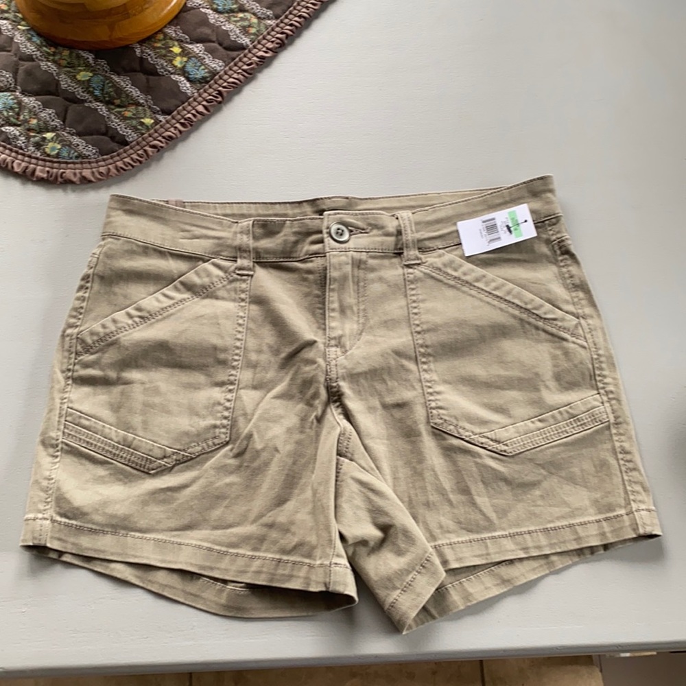 Brand new , with tags still on shorts. Size 8. Tan color